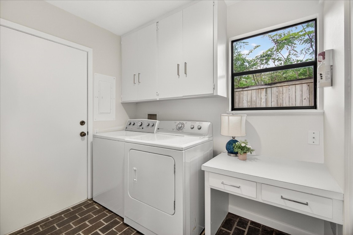 147 Valley Drive Liberty, TX 77575 - Photo 21 of 42 Discover the spacious laundry room, complete with a pantry and space for an extra refrigerator, offering convenience and ample storage.