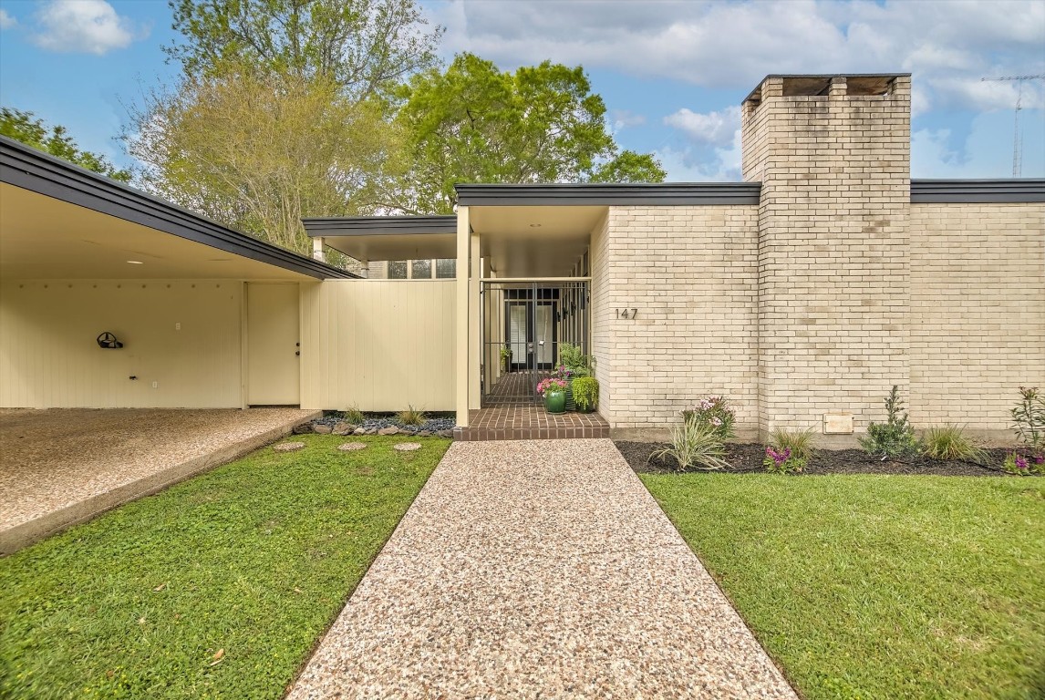 147 Valley Drive Liberty, TX 77575 - Photo 3 of 42 Discover this stunning mid-century gem, featuring timeless design and modern elegance.