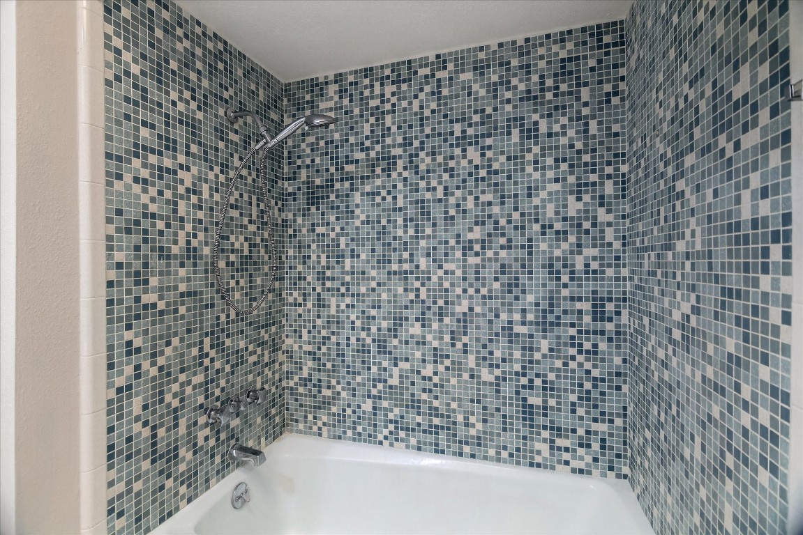 147 Valley Drive Liberty, TX 77575 - Photo 42 of 42 This bathroom features a sleek tub and shower combo.
