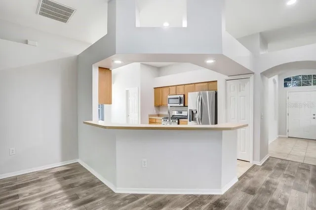 a kitchen with a sink a stove and refrigerator