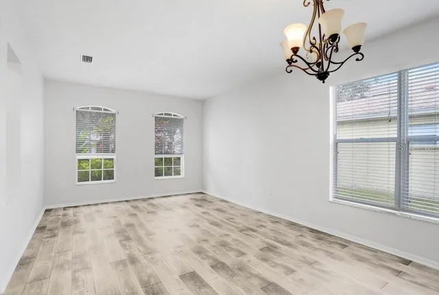 a view of an empty room with a window