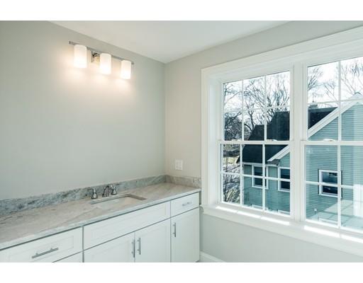 5 Allen Road Winchester, MA 01890 - Photo 27 of 30 a bathroom with a granite countertop sink and next to a window