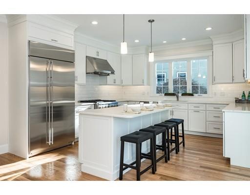 5 Allen Road Winchester, MA 01890 - Photo 5 of 30 a kitchen with kitchen island a sink stove and white cabinets