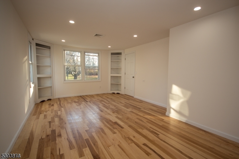 7 Berry Road, Unit A Wantage, NJ 07461 - Photo 11 of 18 a view of empty room with wooden floor and fan