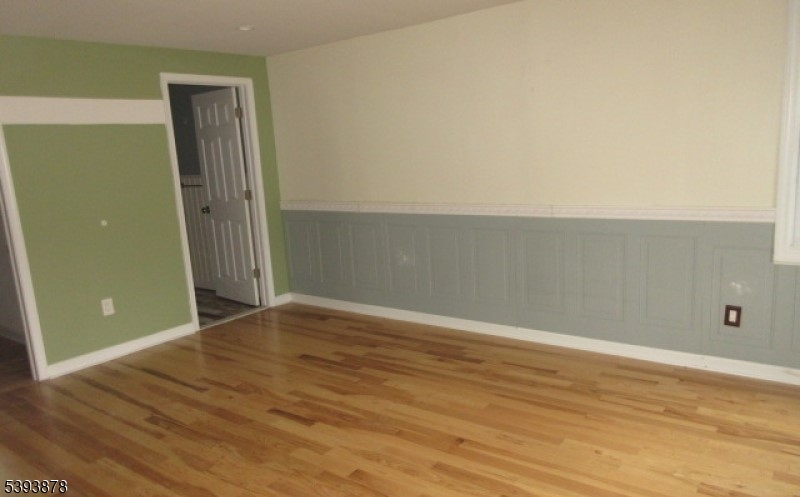 7 Berry Road, Unit A Wantage, NJ 07461 - Photo 16 of 18 an empty room with wooden floor and closet