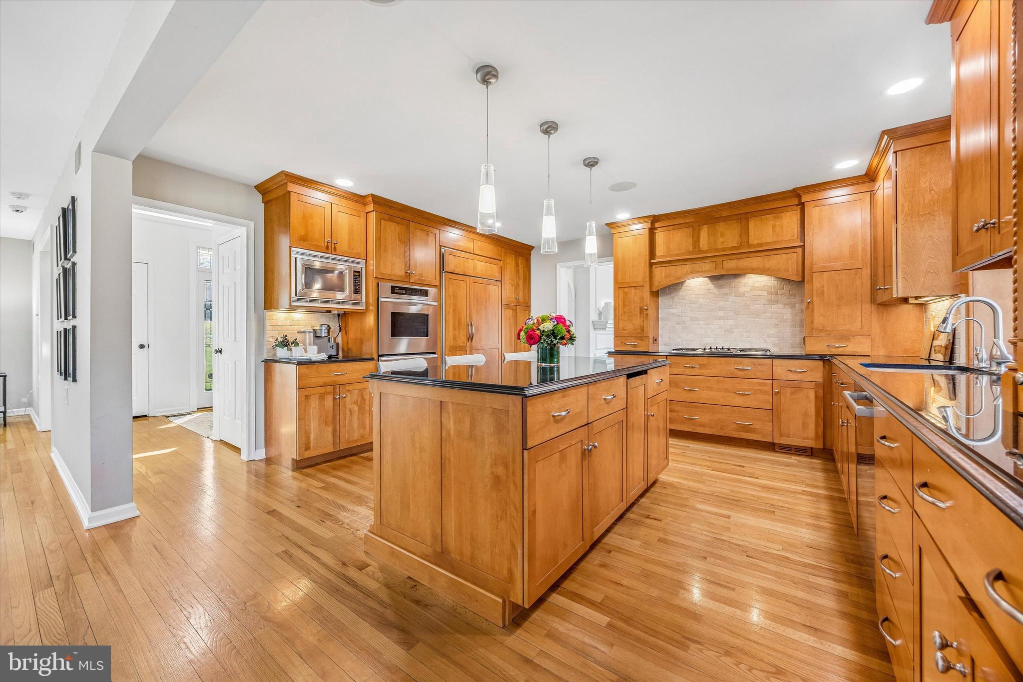 872 Roscommon Road Bryn Mawr, PA 19010 - Photo 14 of 49 a large kitchen with stainless steel appliances granite countertop a large counter top and a stove