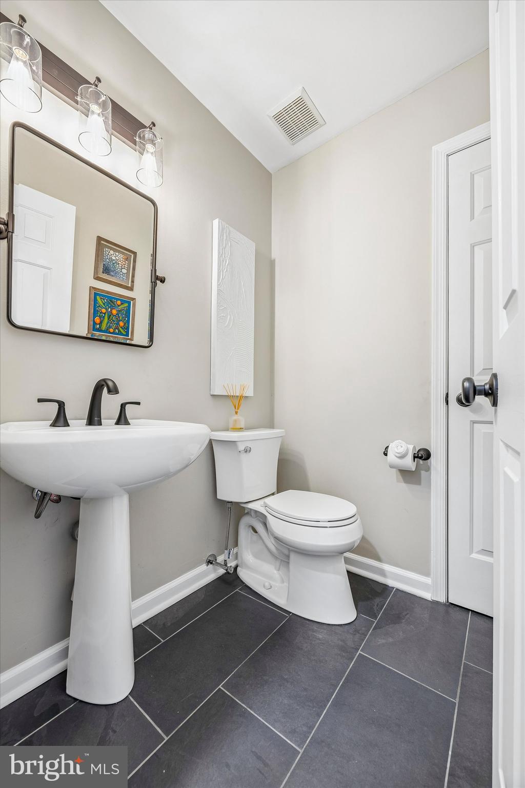872 Roscommon Road Bryn Mawr, PA 19010 - Photo 18 of 49 a bathroom with a sink toilet and mirror