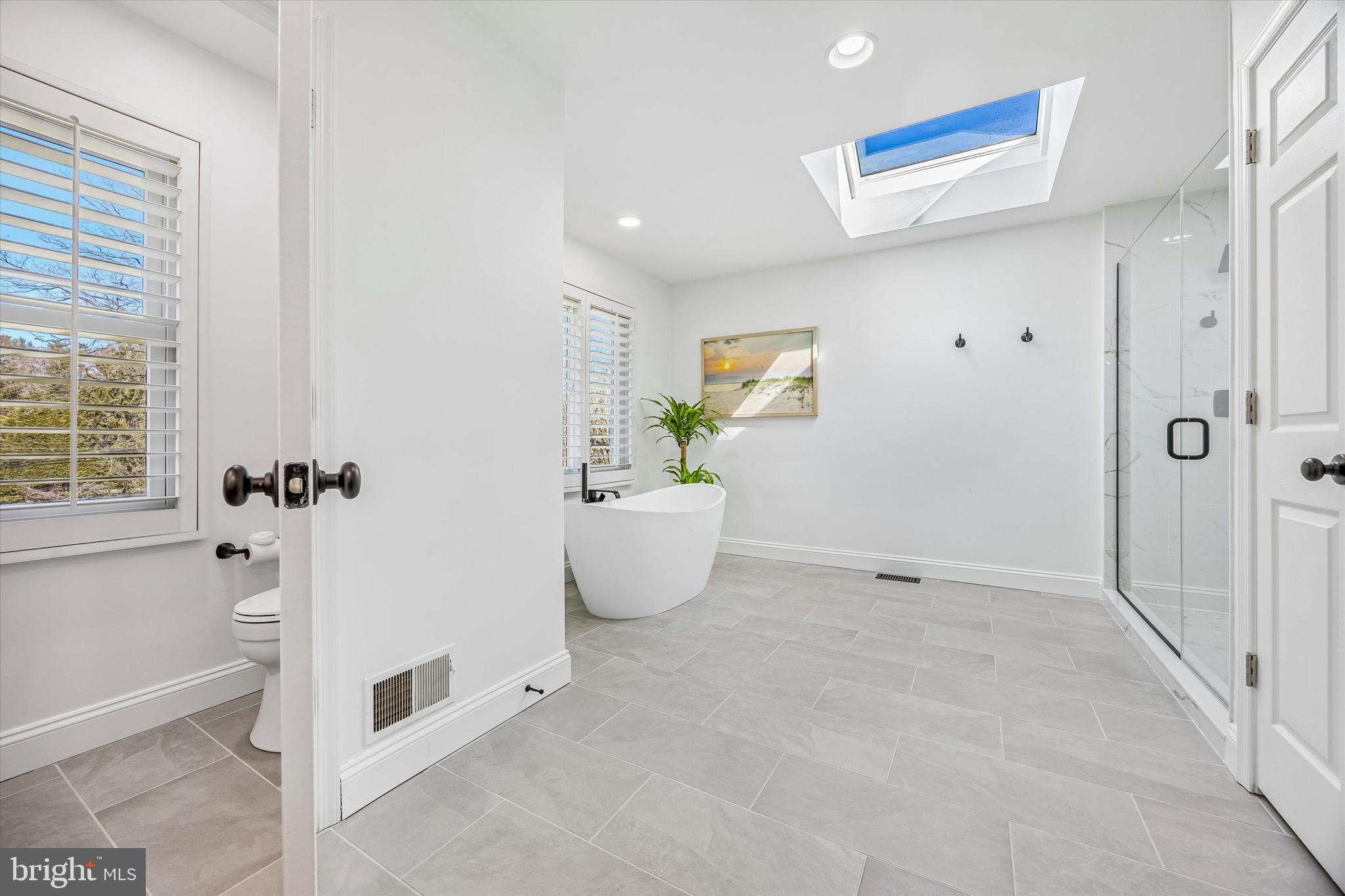 872 Roscommon Road Bryn Mawr, PA 19010 - Photo 24 of 49 a bathroom with a tub and shower