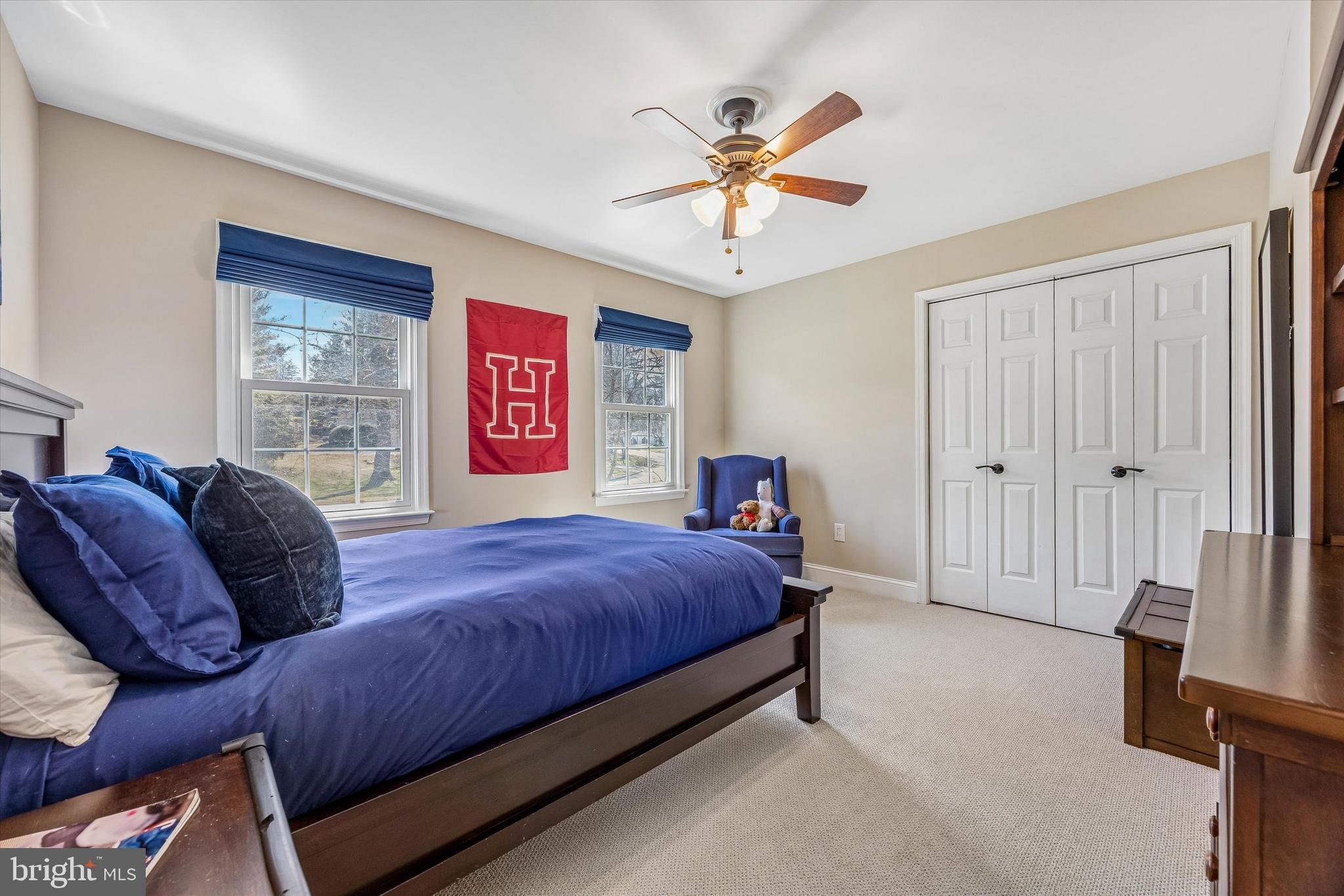 872 Roscommon Road Bryn Mawr, PA 19010 - Photo 35 of 49 a bedroom with a bed and a chandelier