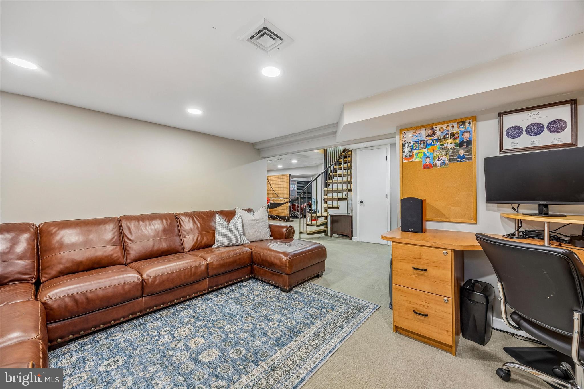 872 Roscommon Road Bryn Mawr, PA 19010 - Photo 42 of 49 a living room with furniture flat screen tv and a window