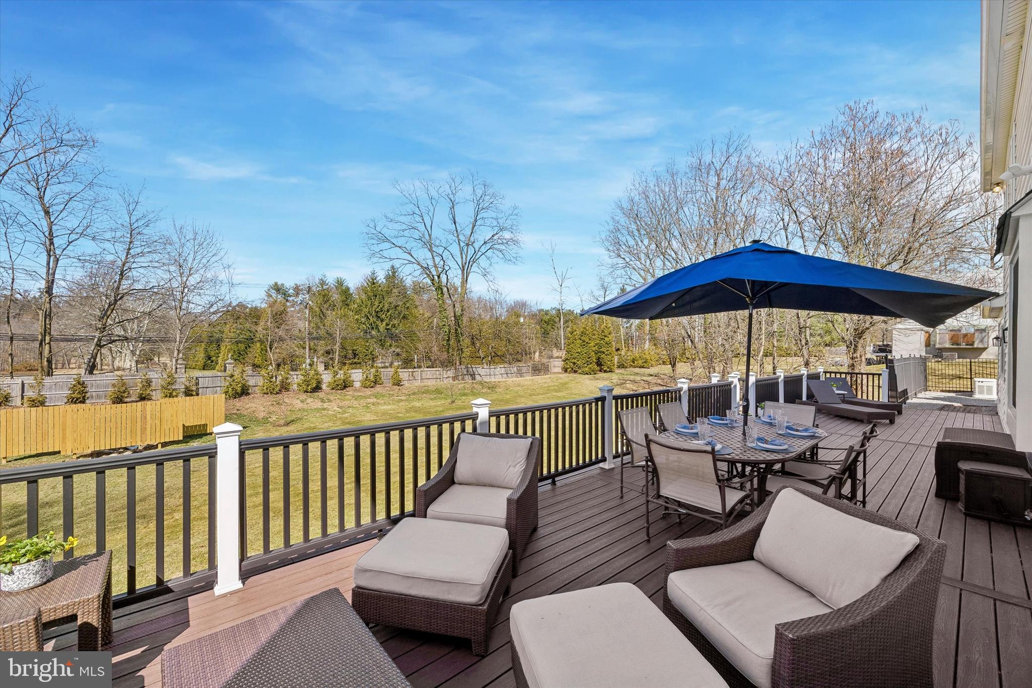 872 Roscommon Road Bryn Mawr, PA 19010 - Photo 47 of 49 a view of a patio with couches under an umbrella
