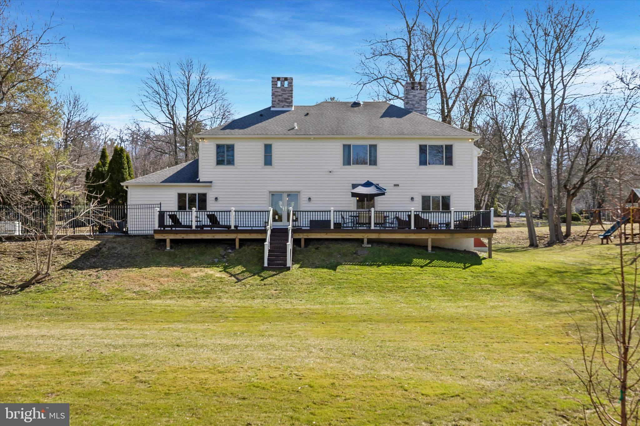 872 Roscommon Road Bryn Mawr, PA 19010 - Photo 49 of 49 a view of a swimming pool with couches chairs and a table and chairs
