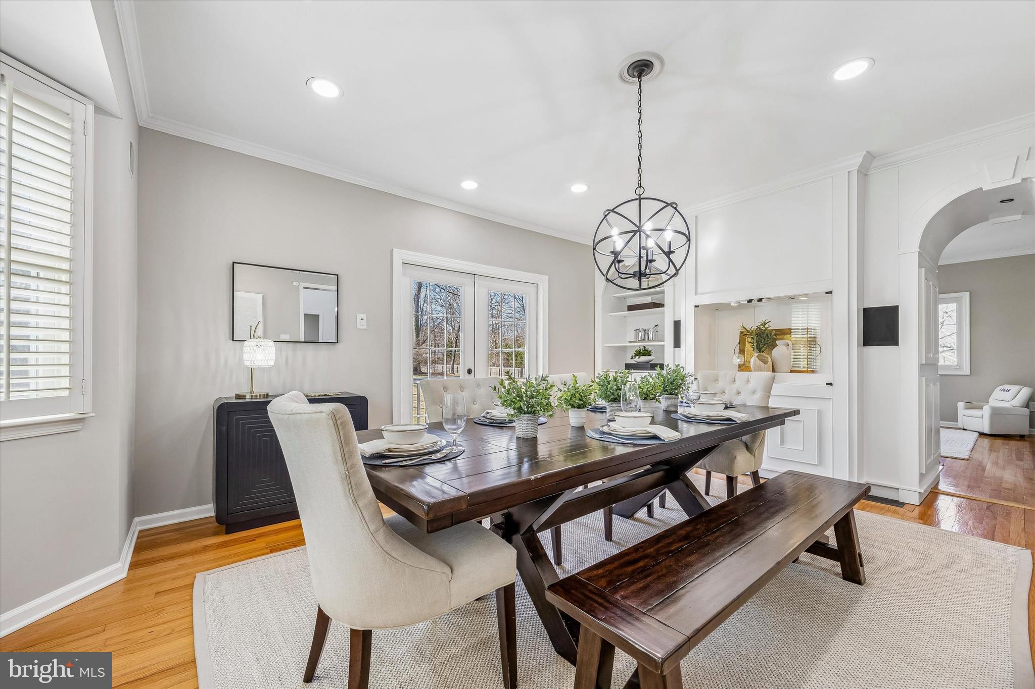 872 Roscommon Road Bryn Mawr, PA 19010 - Photo 5 of 49 a dining room with furniture a rug and a chandelier