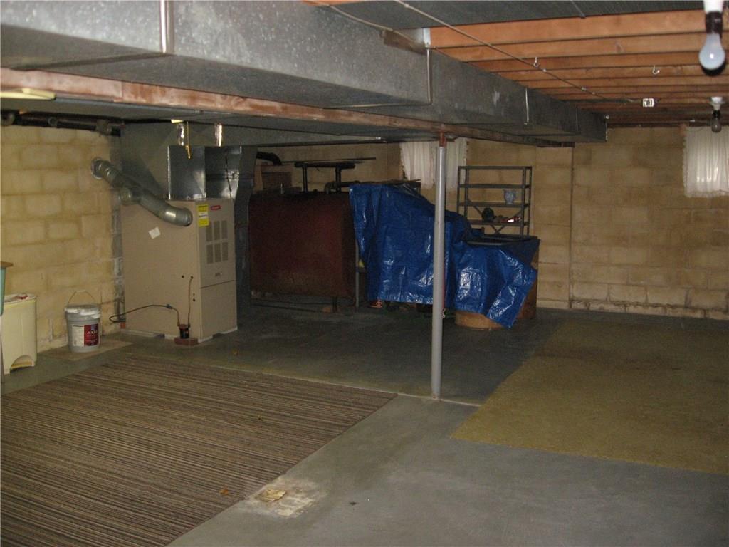 722 Leighty Hollow Road Ruffs Dale, PA 15679 - Photo 14 of 18 Unfinished Basement, High ceiling for added living space. Oil forced air heat, fuel tanks in the corner of the basement.