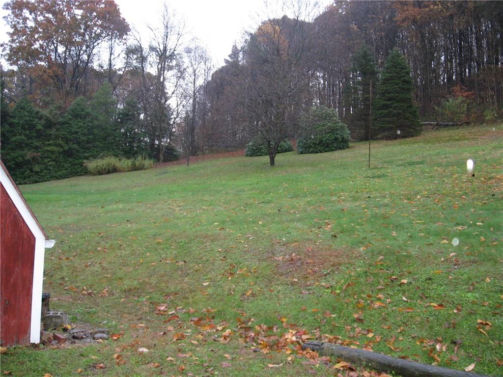 722 Leighty Hollow Road Ruffs Dale, PA 15679 - Photo 3 of 18 Open area to the left of the home.