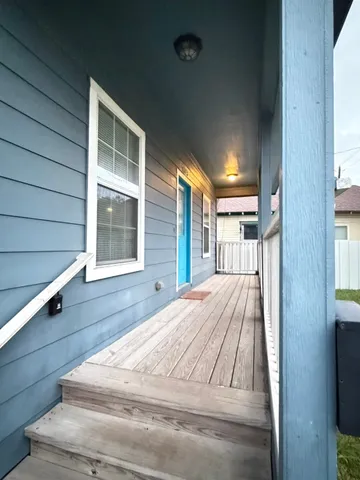 a view of entry way with wooden floor and a window
