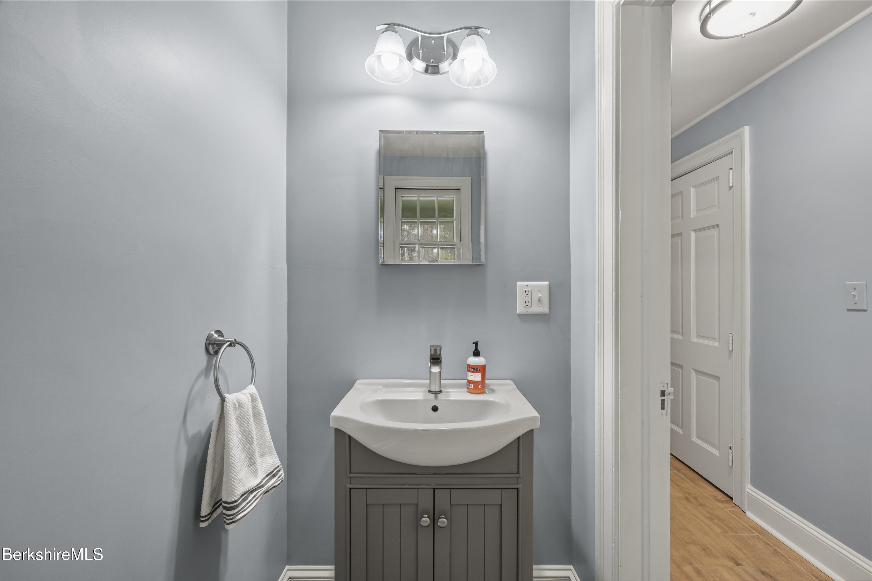 100 South Prospect Street Lee, MA 01238 - Photo 15 of 39 a bathroom with a sink vanity and a mirror