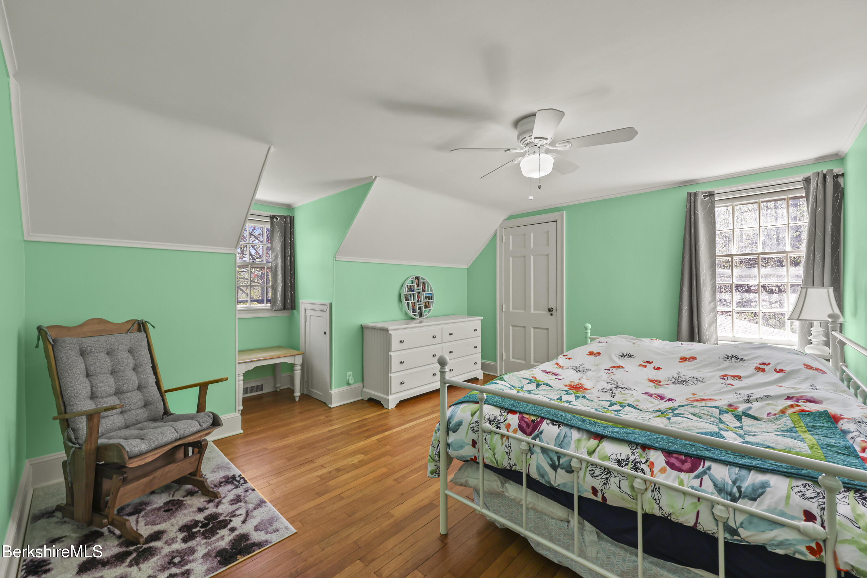100 South Prospect Street Lee, MA 01238 - Photo 20 of 39 a bedroom with a bed and a table in it