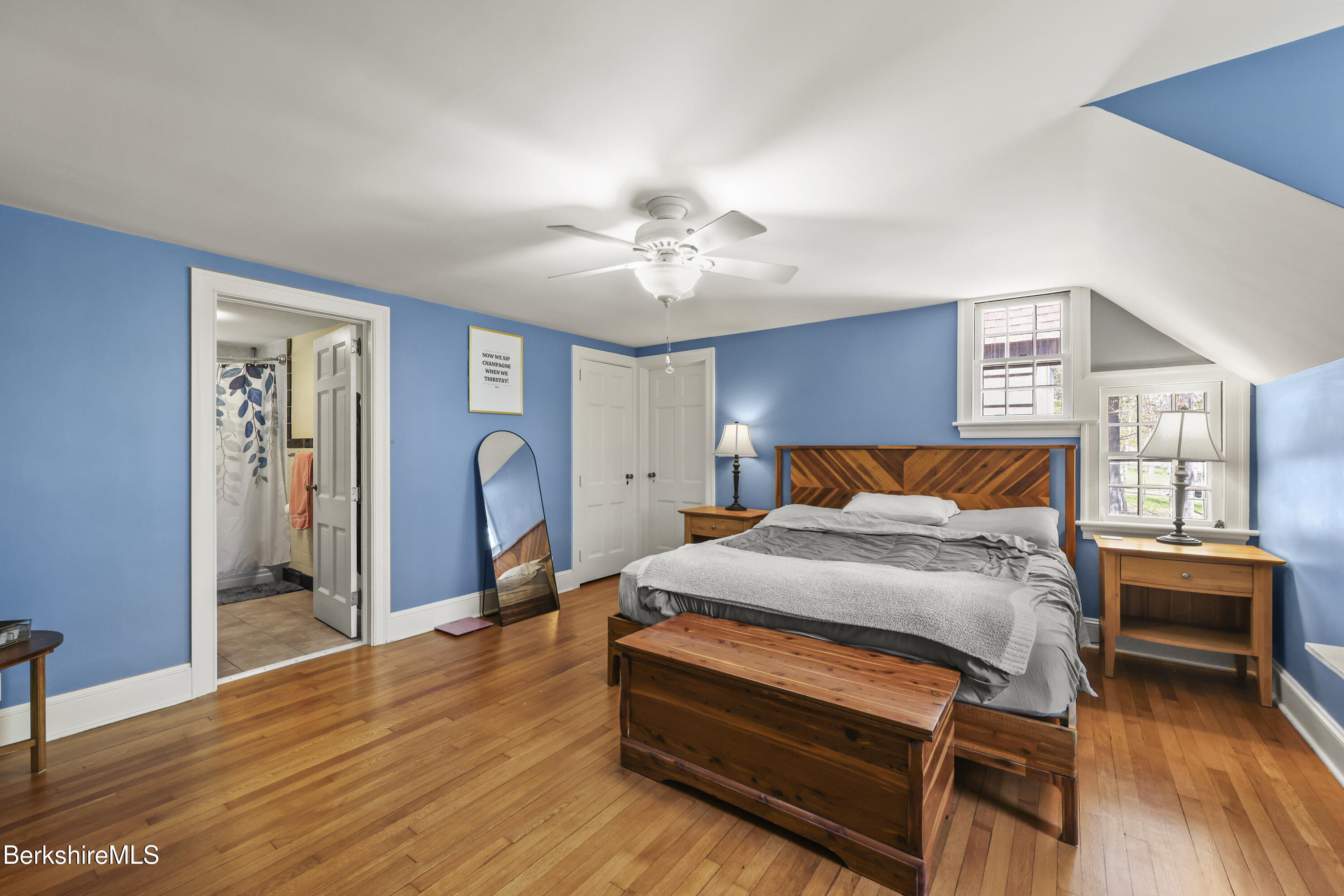 100 South Prospect Street Lee, MA 01238 - Photo 22 of 39 a bed room with a bed and a chandelier
