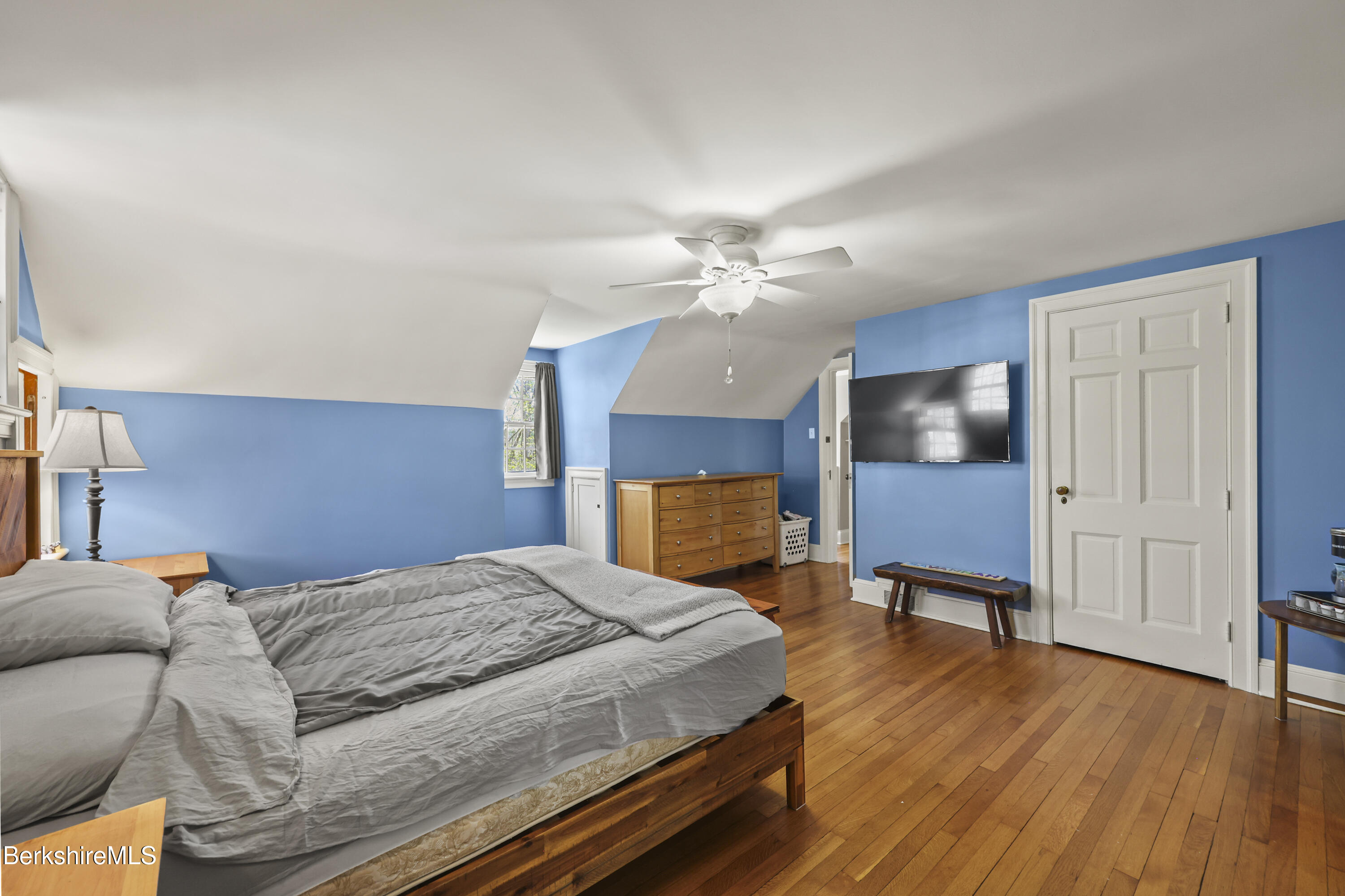 100 South Prospect Street Lee, MA 01238 - Photo 24 of 39 a bedroom with a bed and a chandelier