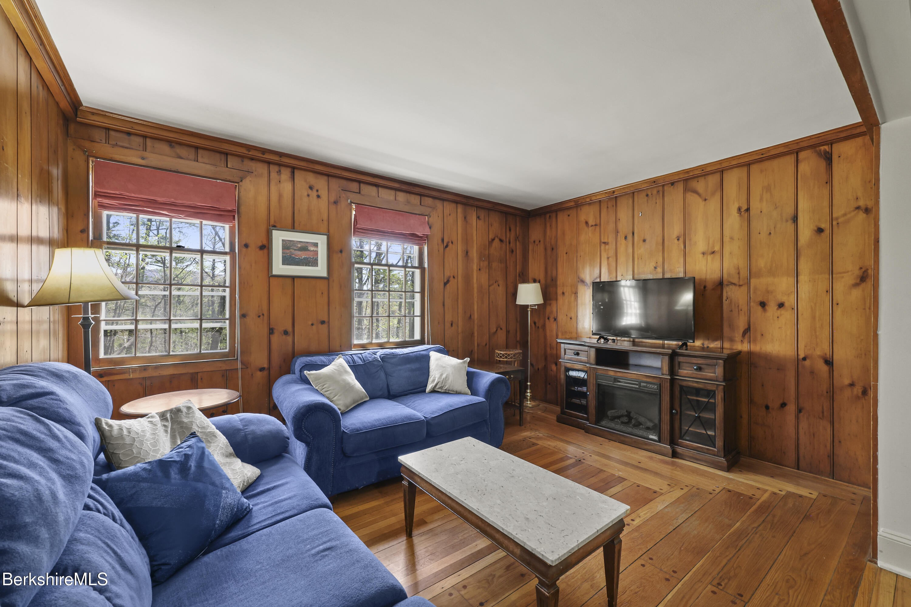 100 South Prospect Street Lee, MA 01238 - Photo 28 of 39 a living room with furniture and a flat screen tv