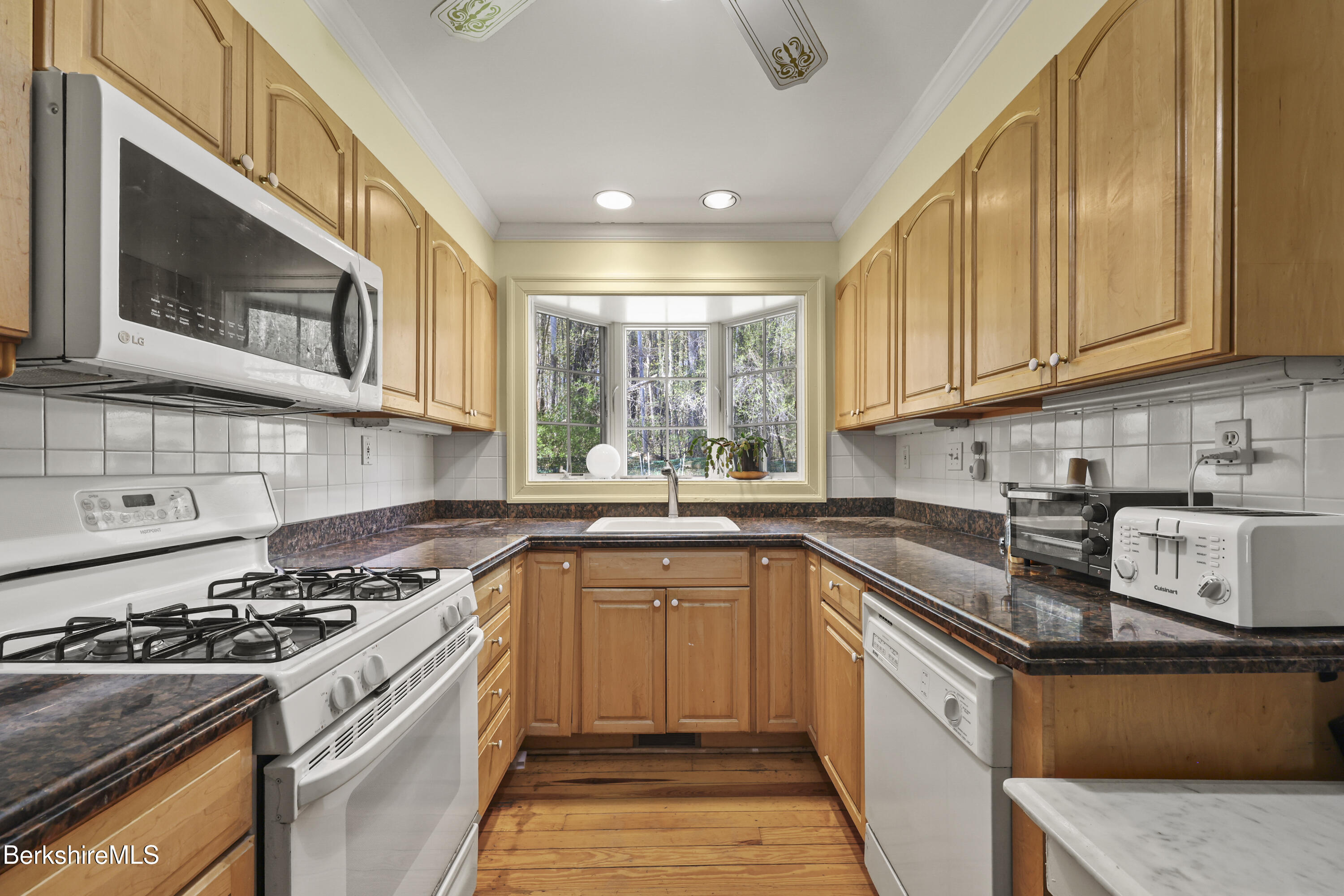 100 South Prospect Street Lee, MA 01238 - Photo 29 of 39 a kitchen with stainless steel appliances granite countertop a stove and a sink