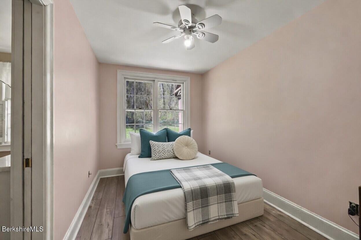 100 South Prospect Street Lee, MA 01238 - Photo 31 of 39 a bedroom with a large bed and a chandelier