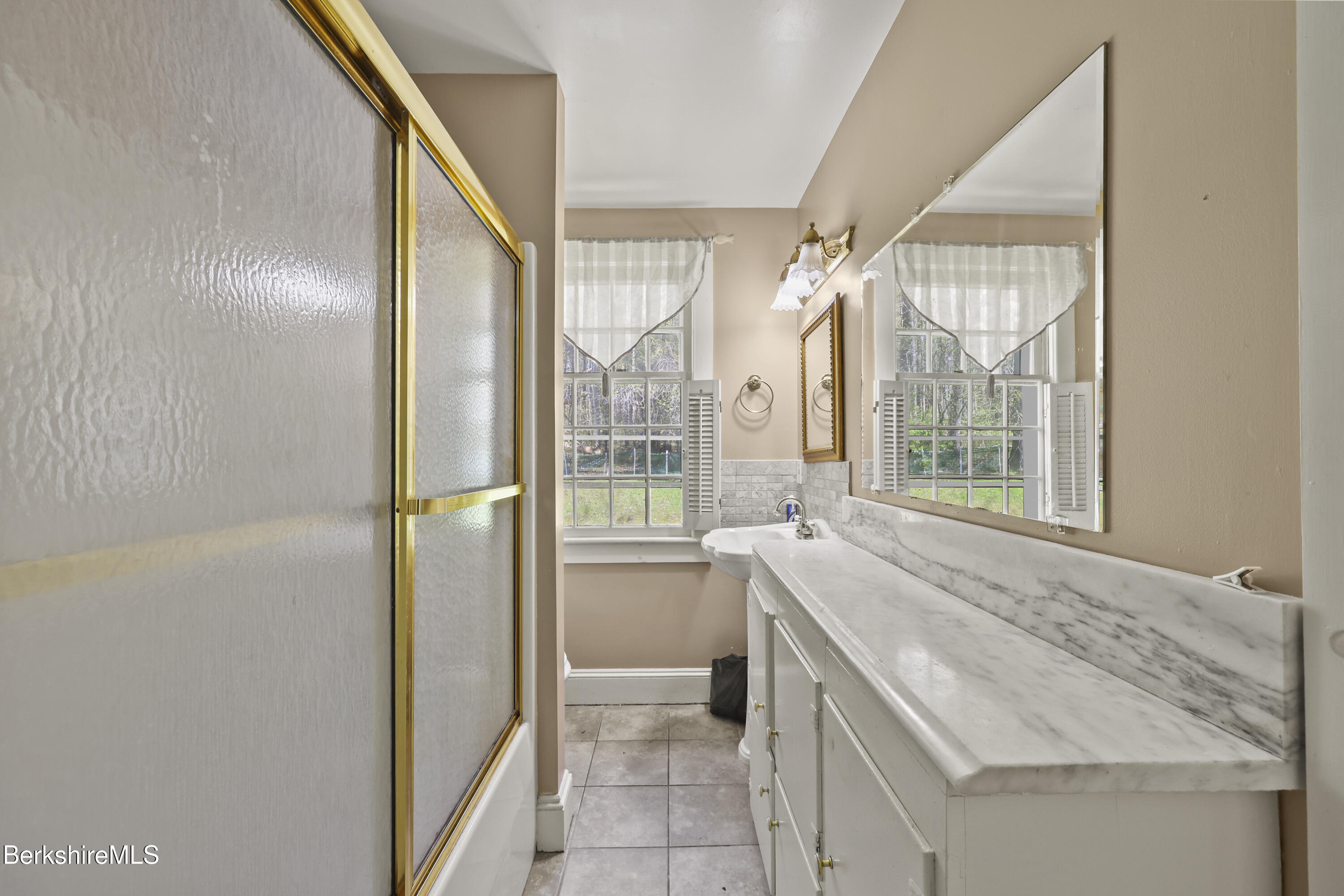 100 South Prospect Street Lee, MA 01238 - Photo 32 of 39 a bathroom with a granite countertop sink and a large mirror