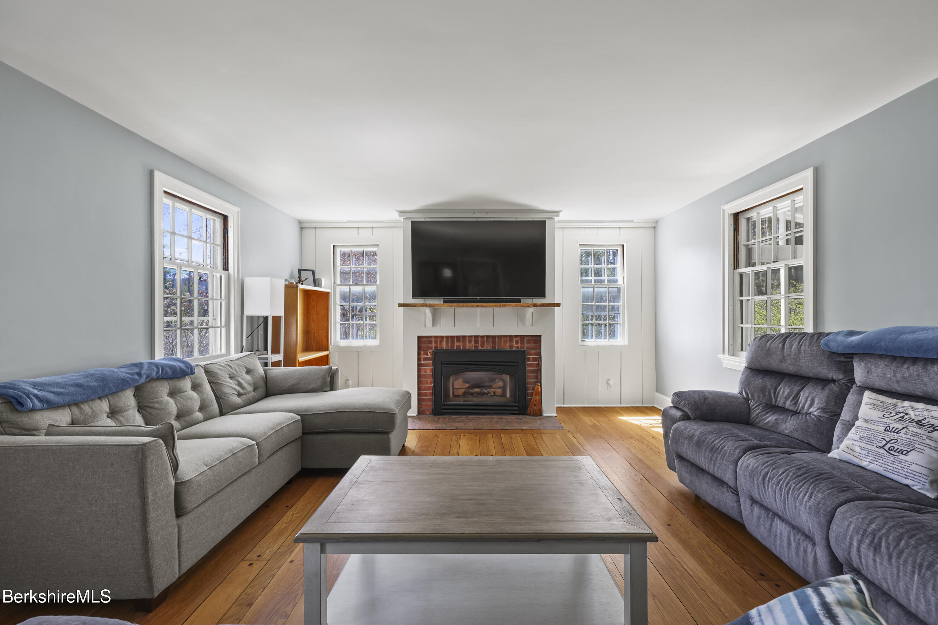 100 South Prospect Street Lee, MA 01238 - Photo 4 of 39 a living room with furniture and a fireplace