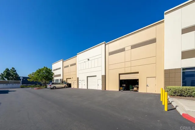 a view of building with yard and staircase