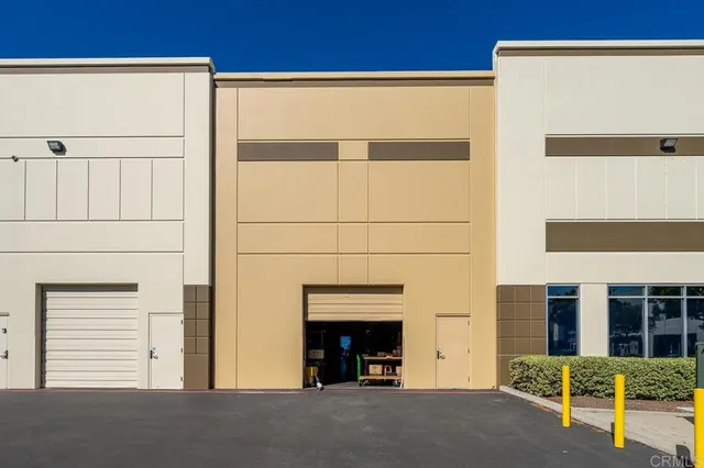 a view of a house with a door and a window