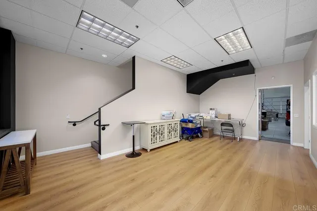 a view of a livingroom with furniture and hardwood floor