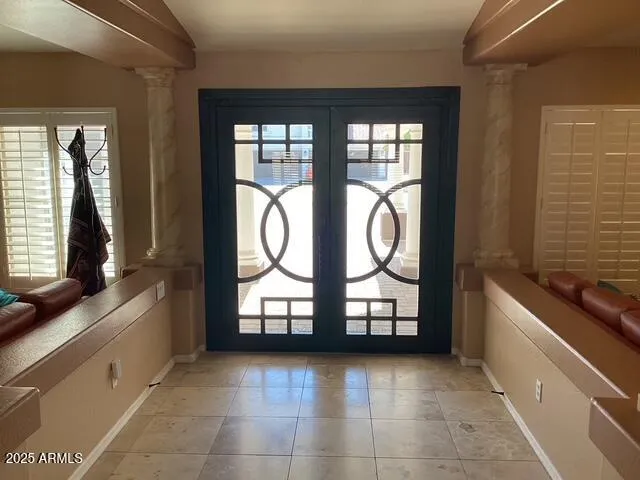 a living room with furniture and a large window