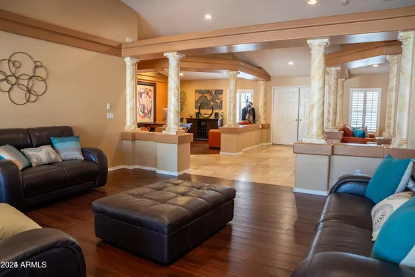 a living room with furniture and a large window