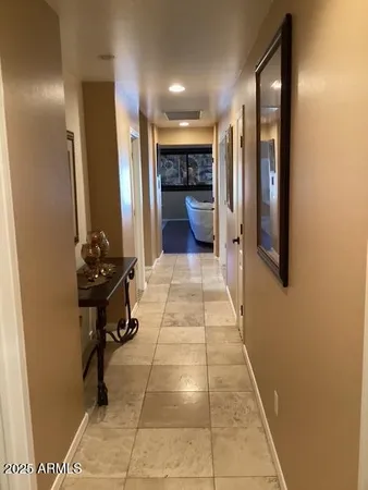 a lobby with furniture and a mirror