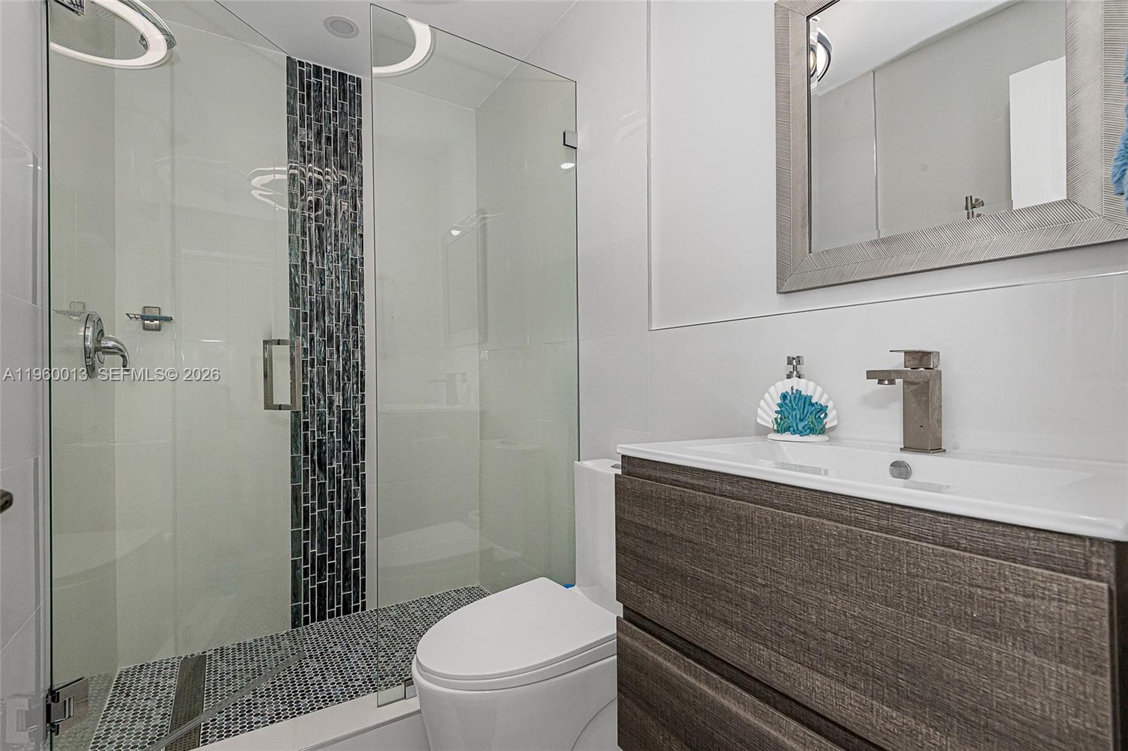 68 Mutiny Place Key Largo, FL 33037 - Photo 11 of 53 a bathroom with a sink a toilet and shower