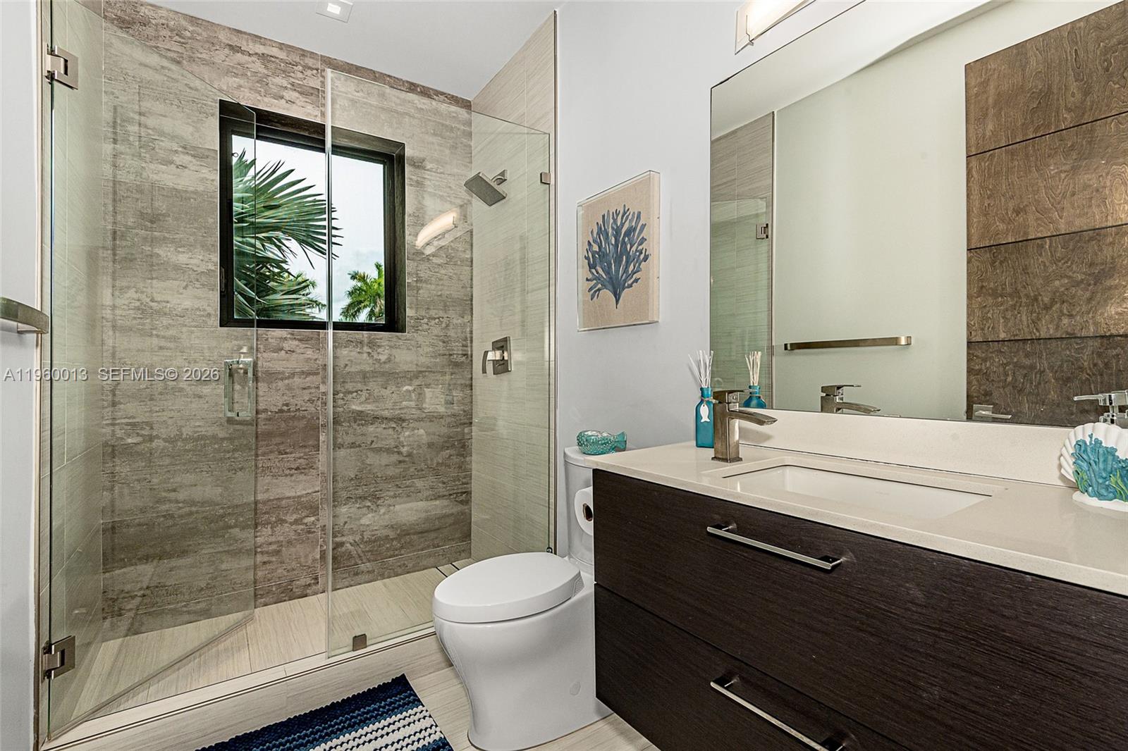68 Mutiny Place Key Largo, FL 33037 - Photo 33 of 53 a bathroom with a sink a toilet a mirror and shower