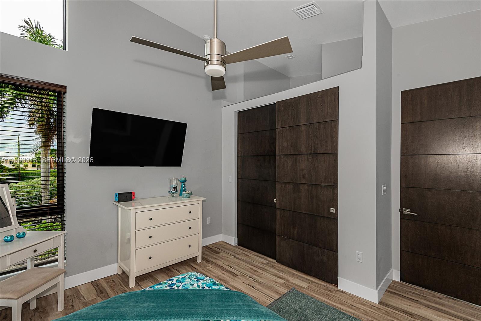 68 Mutiny Place Key Largo, FL 33037 - Photo 37 of 53 a room with a flat screen tv dressers and a chandelier