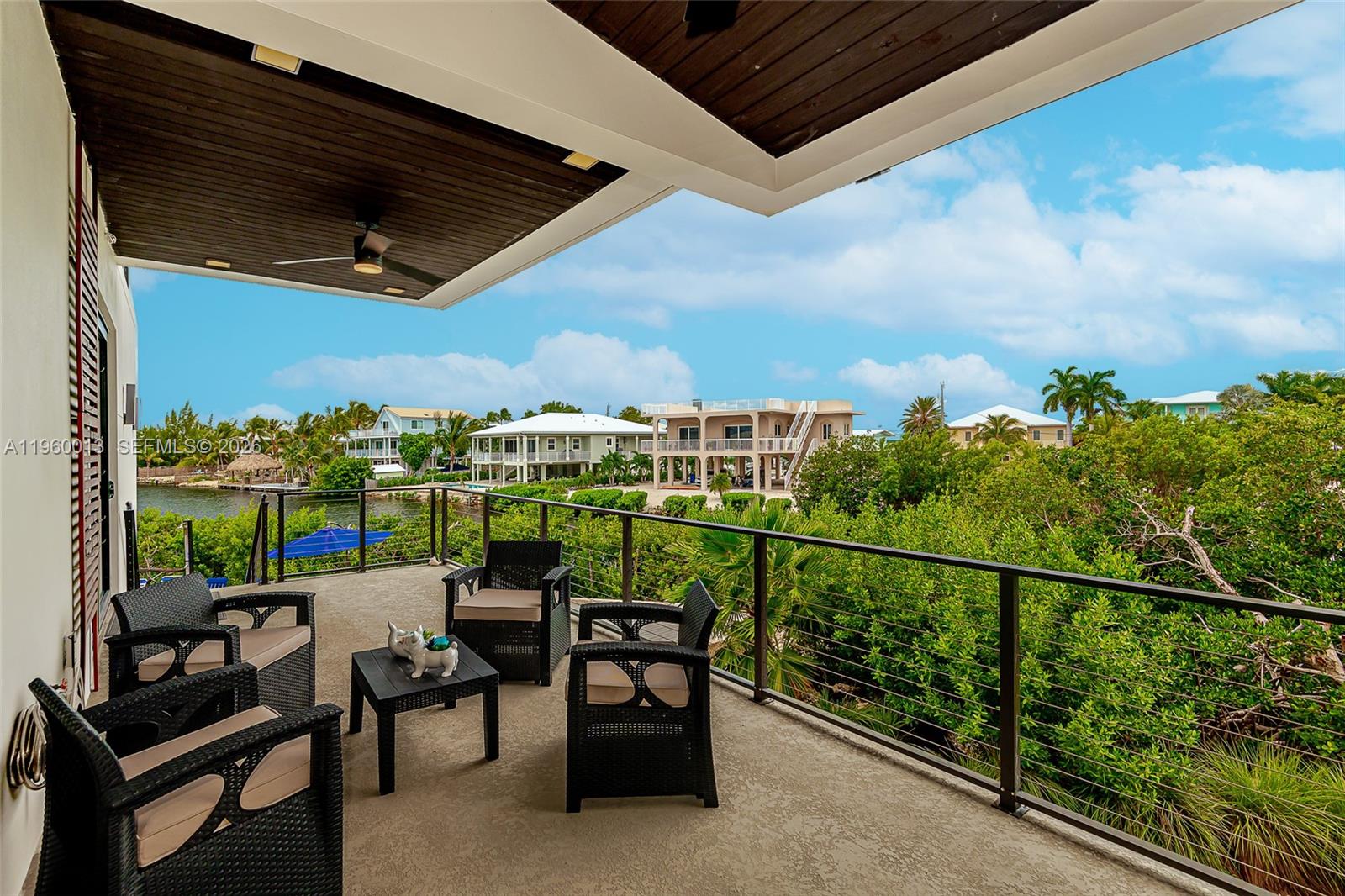 68 Mutiny Place Key Largo, FL 33037 - Photo 53 of 53 a view of a chairs and table in patio