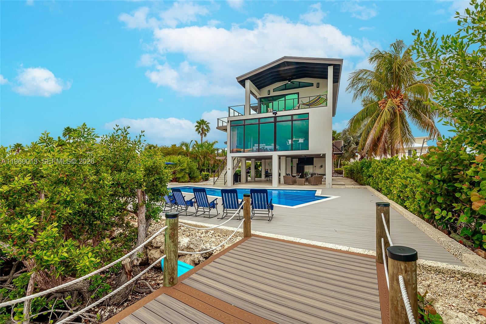 68 Mutiny Place Key Largo, FL 33037 - Photo 8 of 53 a view of a balcony with chairs