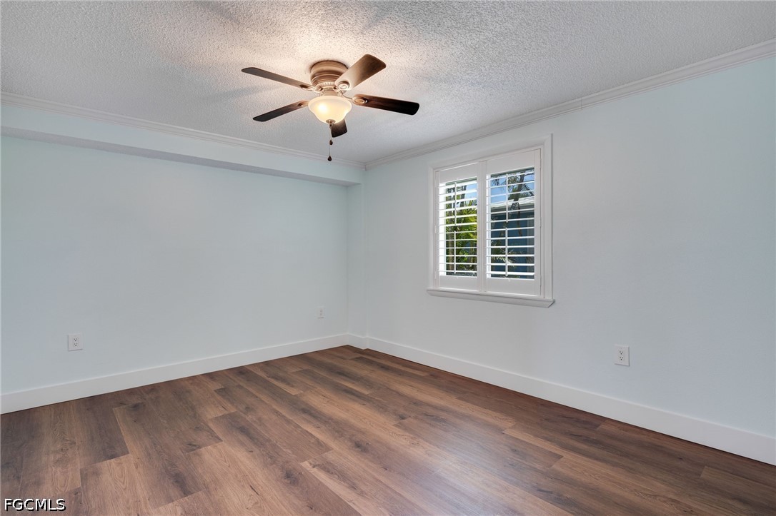 2639 Bridgeview Street Matlacha, FL 33993 - Photo 11 of 28 a view of empty room with wooden floor and fan