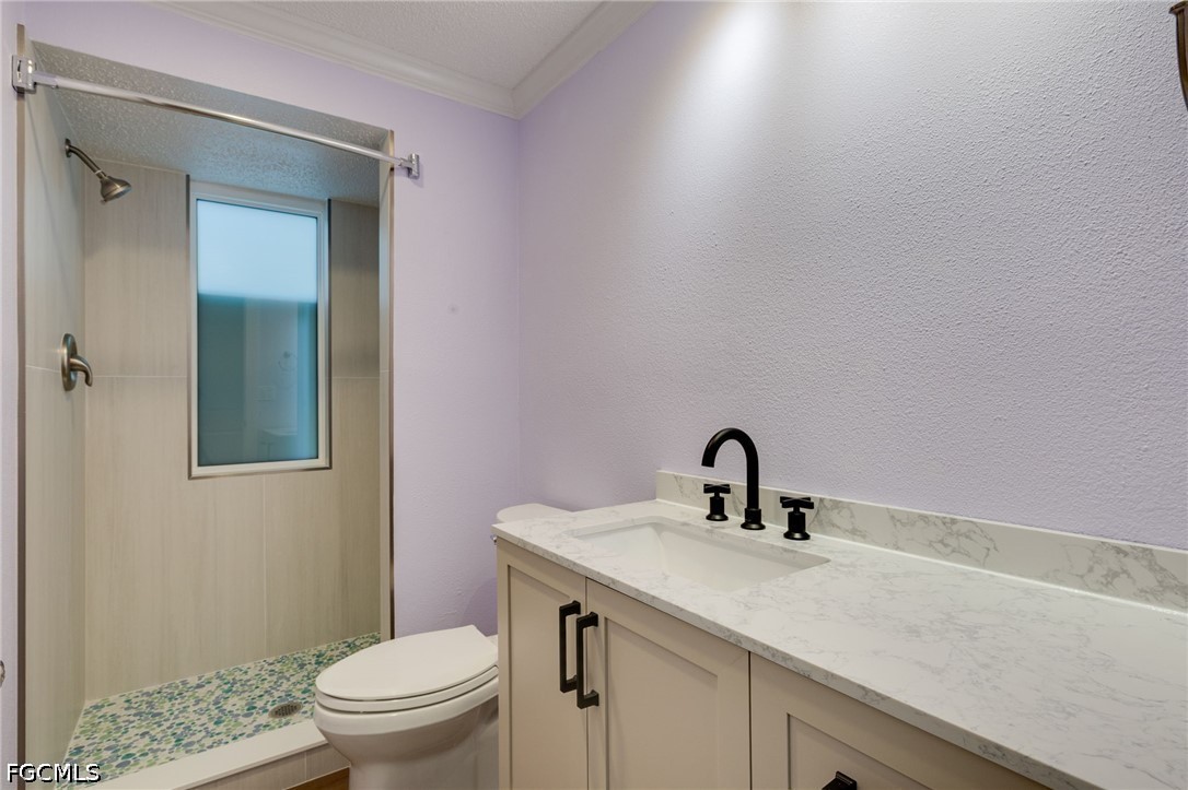 2639 Bridgeview Street Matlacha, FL 33993 - Photo 13 of 28 a bathroom with a sink toilet and vanity