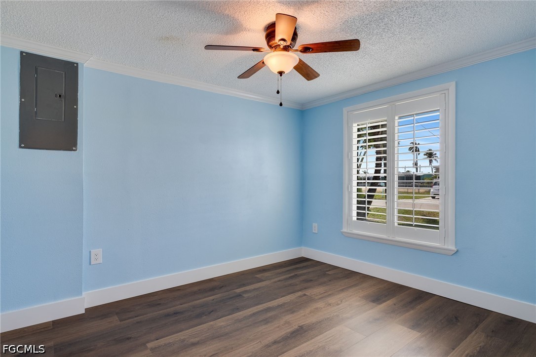 2639 Bridgeview Street Matlacha, FL 33993 - Photo 14 of 28 a view of an empty room with wooden floor and a window