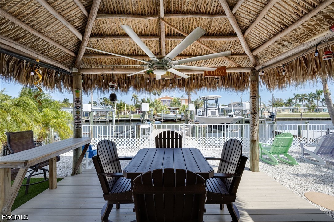 2639 Bridgeview Street Matlacha, FL 33993 - Photo 18 of 28 a view of a patio with a table and chairs