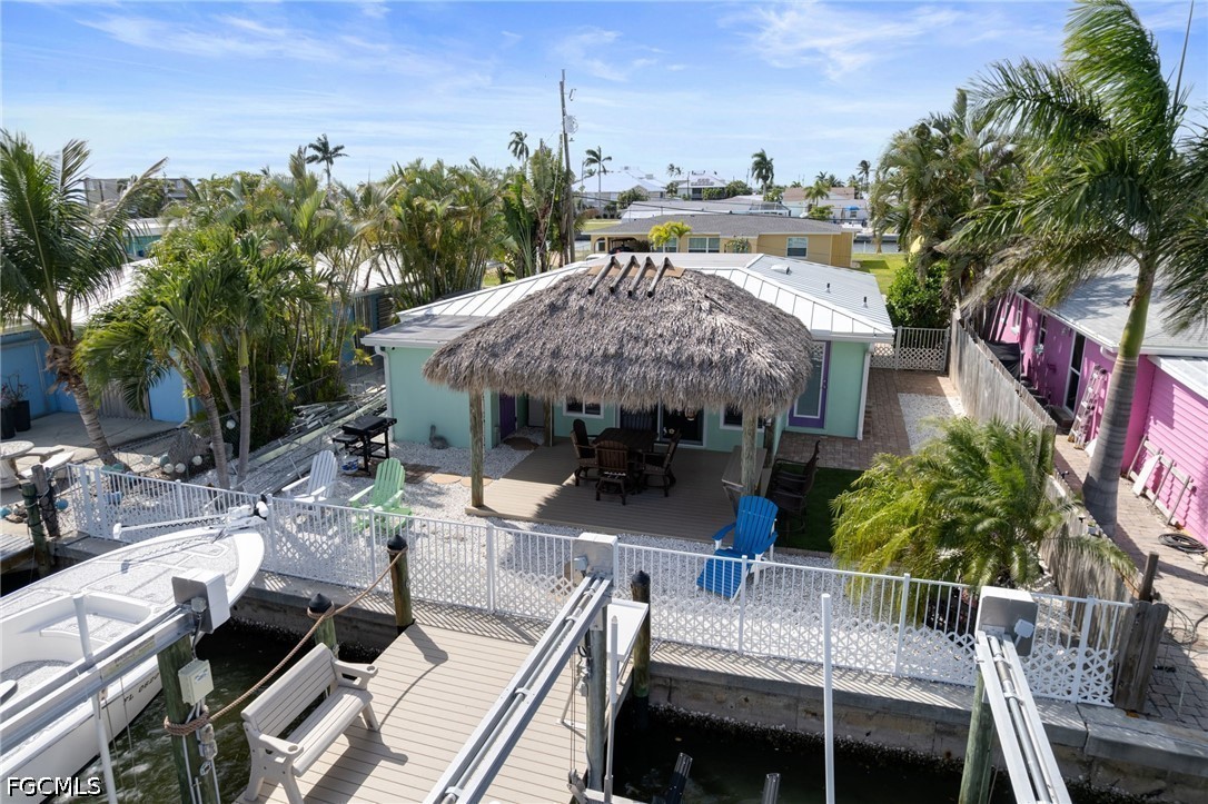 2639 Bridgeview Street Matlacha, FL 33993 - Photo 26 of 28 a view of house with patio and outdoor seating