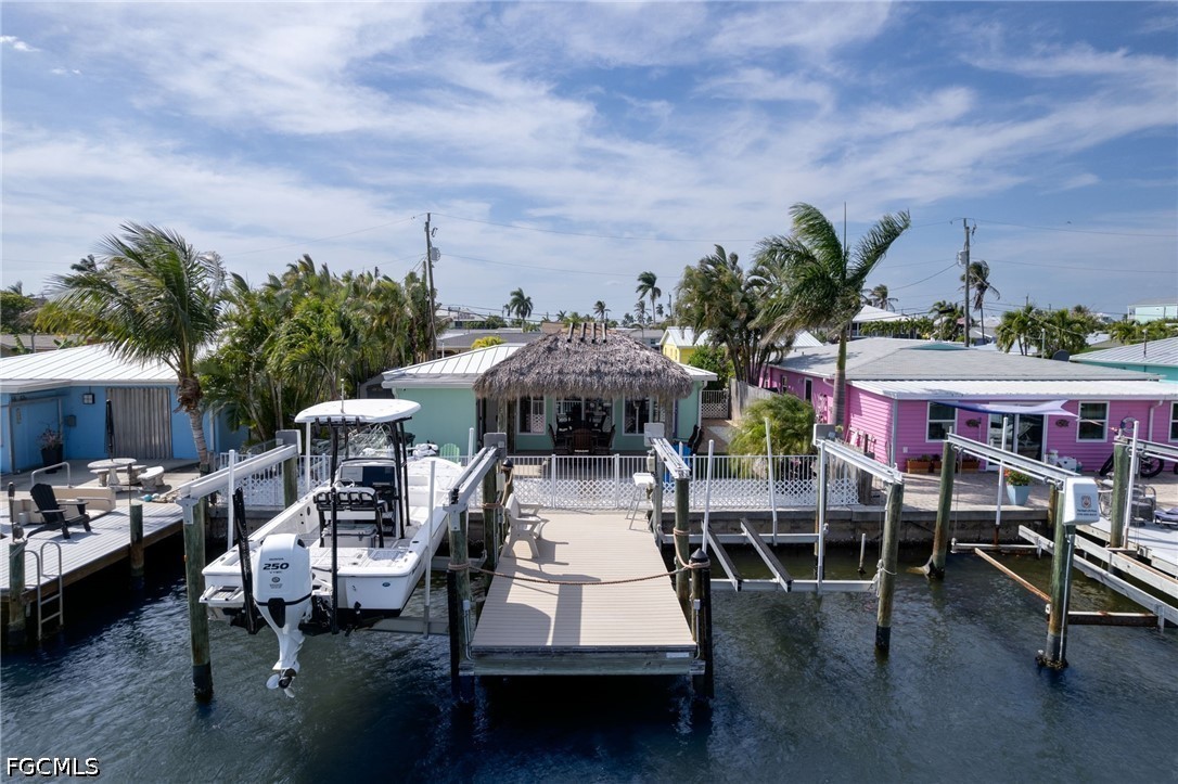 2639 Bridgeview Street Matlacha, FL 33993 - Photo 27 of 28 a roof deck with table and chairs potted plants with sky view