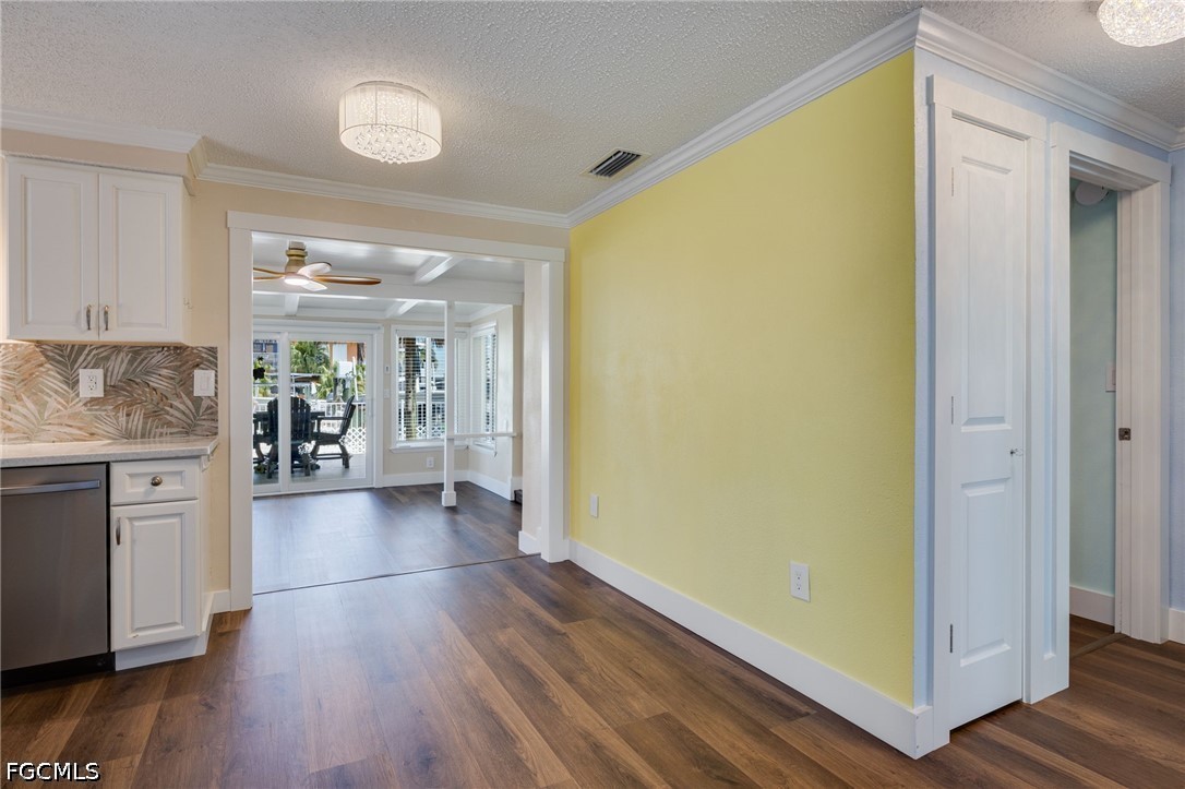 2639 Bridgeview Street Matlacha, FL 33993 - Photo 6 of 28 a view of a hallway view with wooden floor and windows