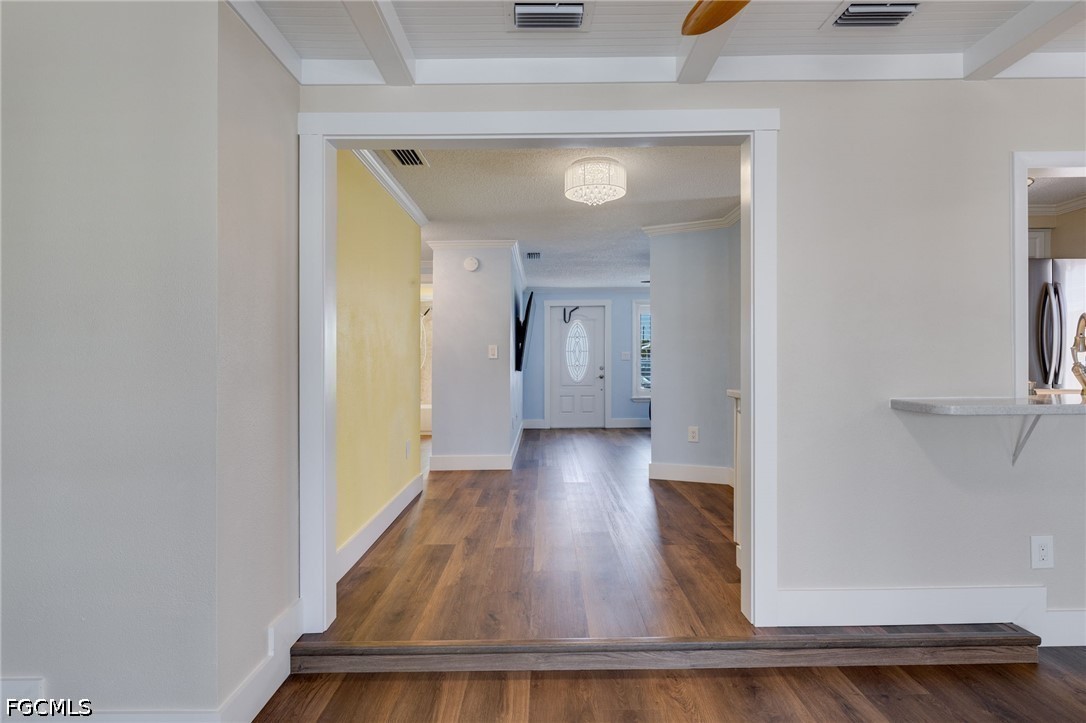 2639 Bridgeview Street Matlacha, FL 33993 - Photo 9 of 28 a view of a hallway with wooden floor