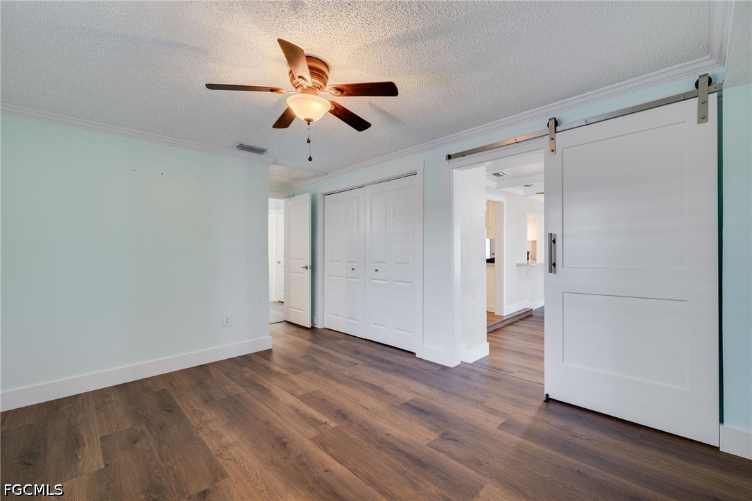 2639 Bridgeview Street Matlacha, FL 33993 - Photo 10 of 28 a view of an empty room and wooden floor