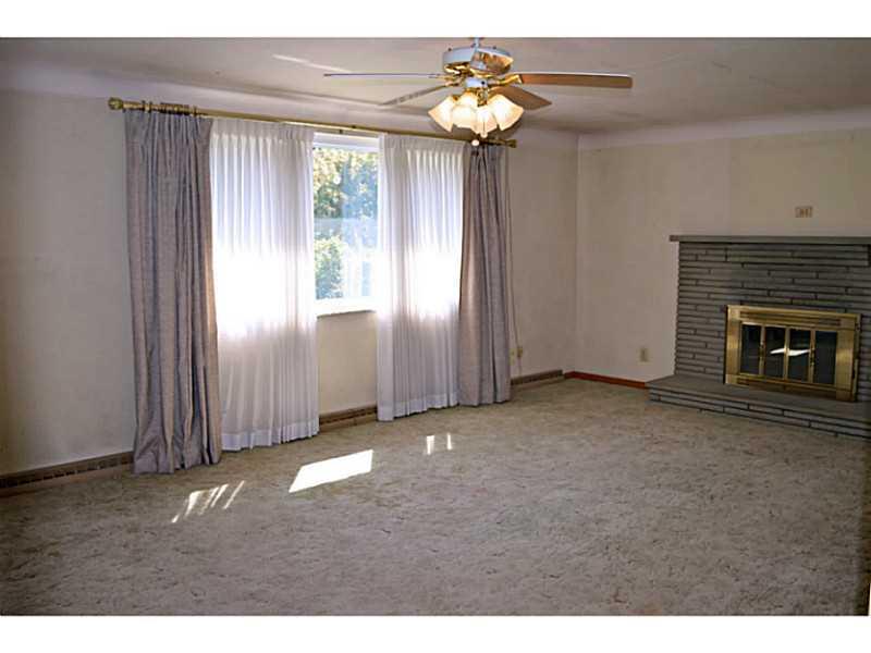 620 Wendel Road Irwin, PA 15642 - Photo 5 of 12 Family Room. Wood-burning fireplace and large window make for a perfect gathering place for the upcoming holidays